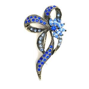 Silvertone Vintage bow pin with light and royal blue rhinestones